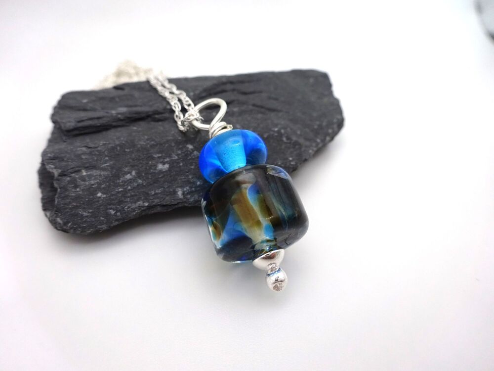 blue and brown pendant