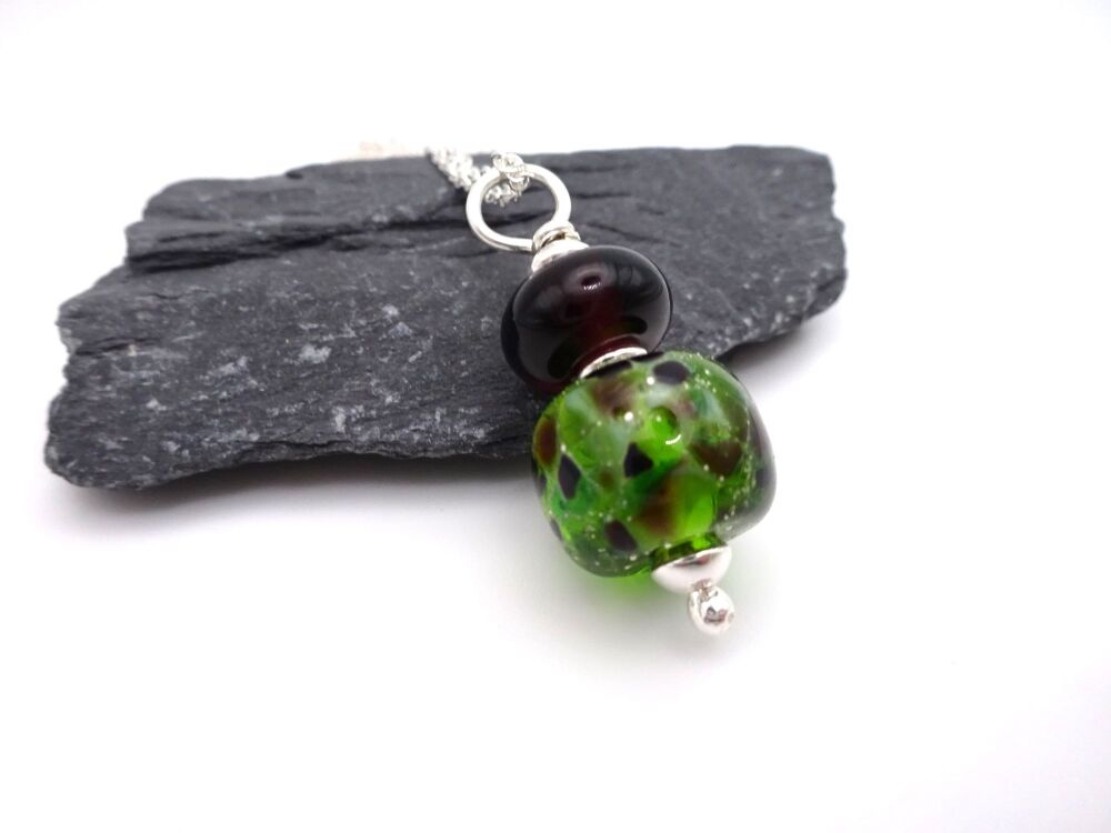 purple and green silver pendant