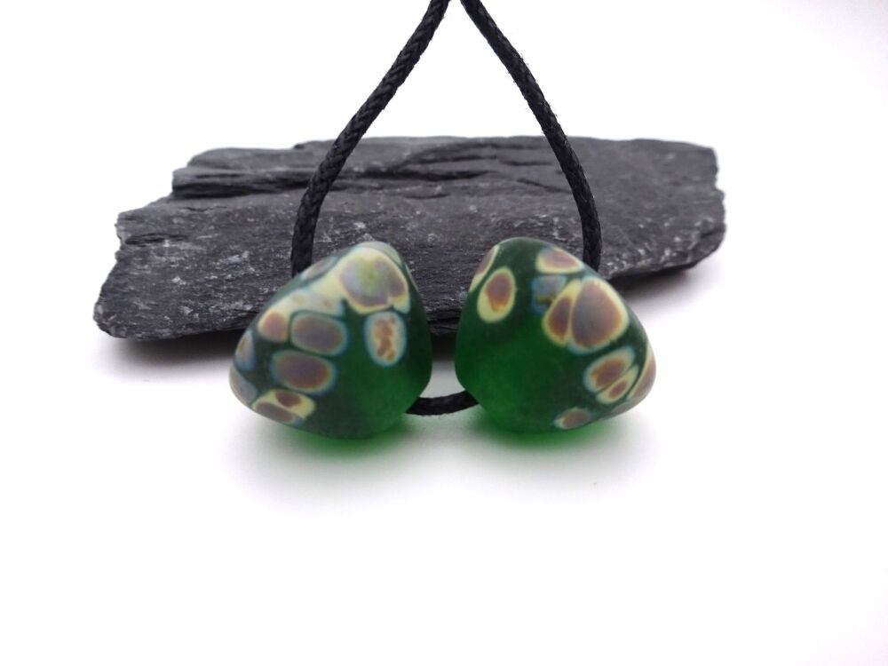 dark green raku cones tumbled