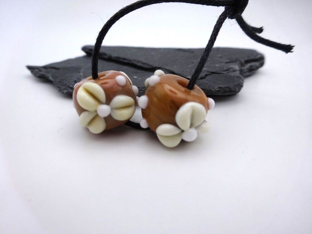 white flowers on brown