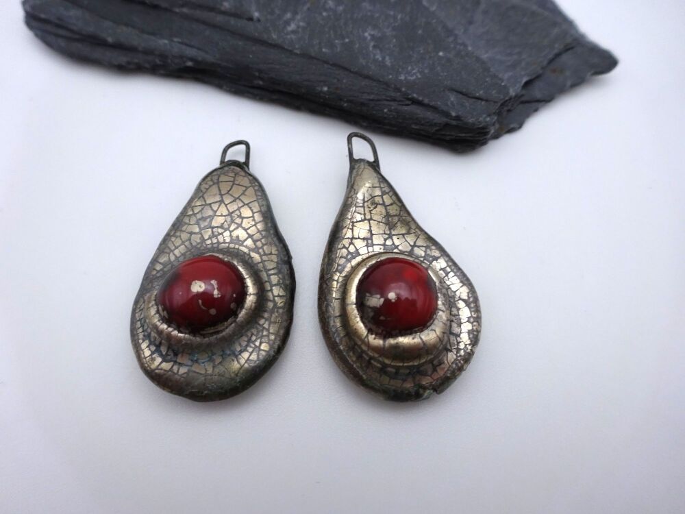 red and silver ceramic drops