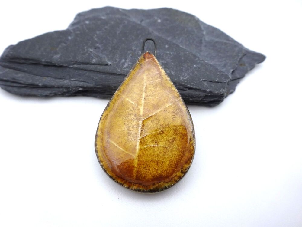 brown ceramic leaf pendant