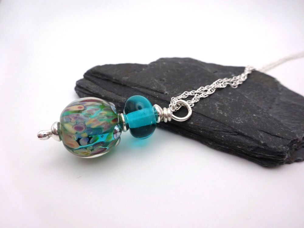 green speckled sphere