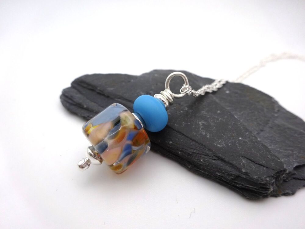 peach and blue pendant