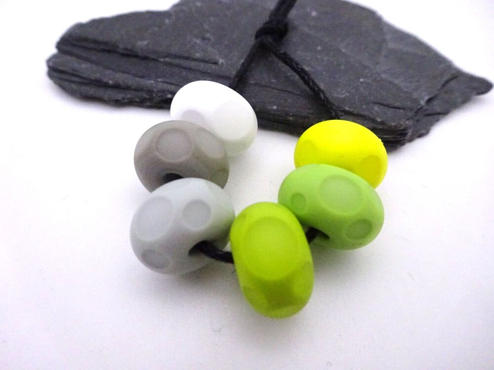 green, grey, yellow tumbled spots