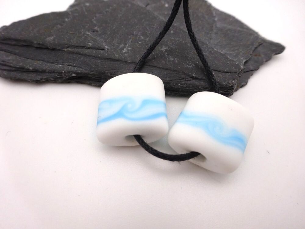 white and blue wrapped pillows