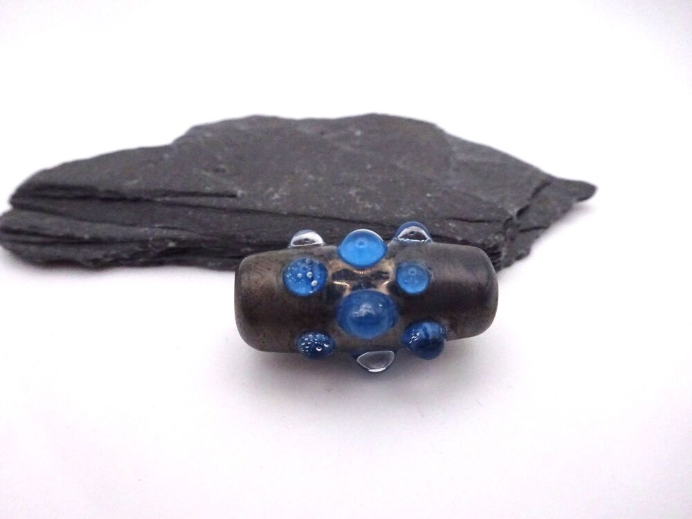 silver and blue raised dots