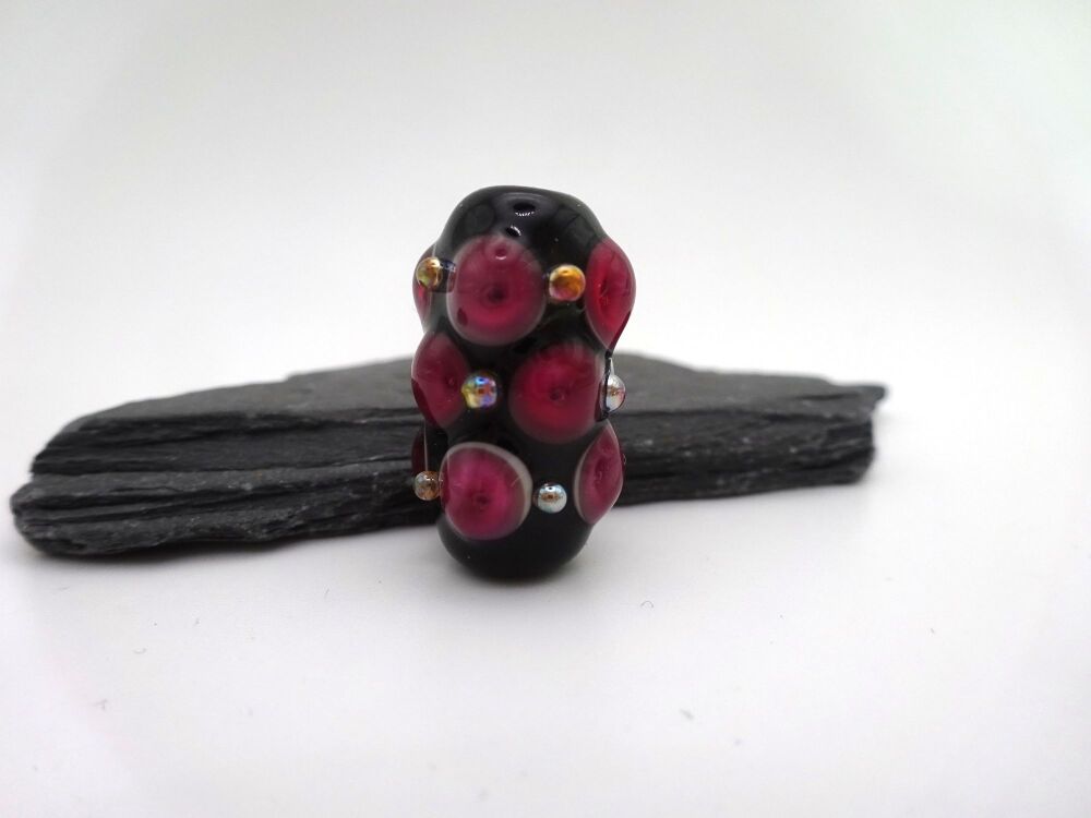black and pink raised dots