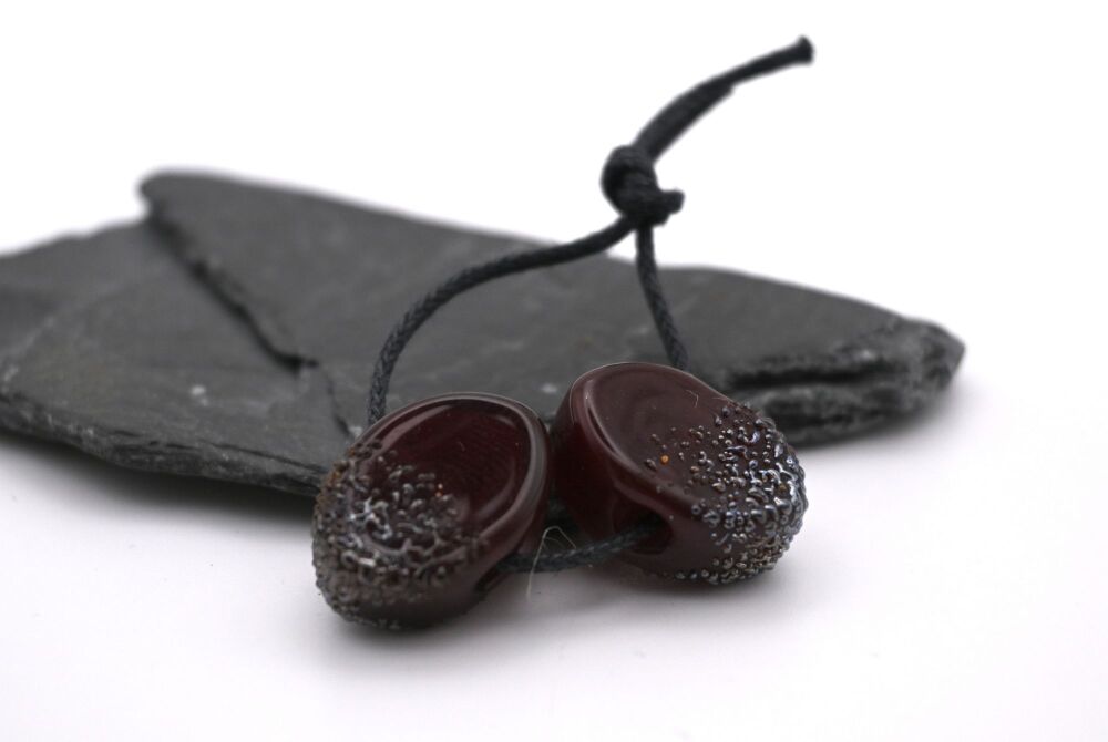 dark red and silver ovals