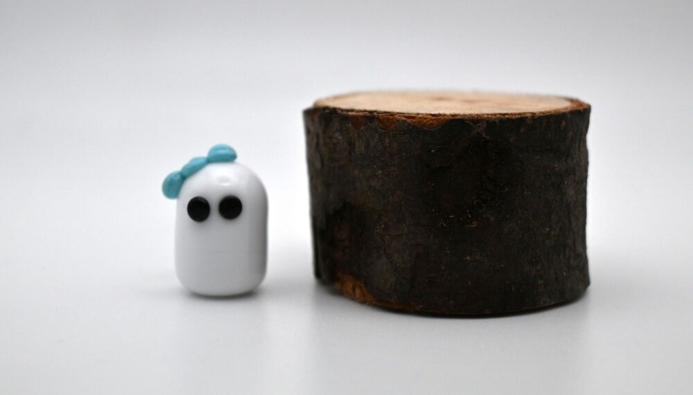 small ghost with blue bow