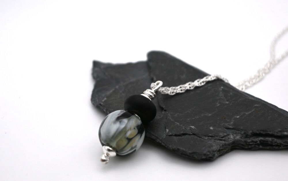 black, grey and white sphere