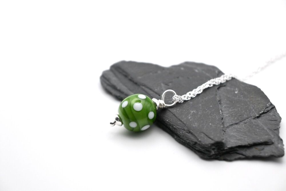 green polka dot pendant