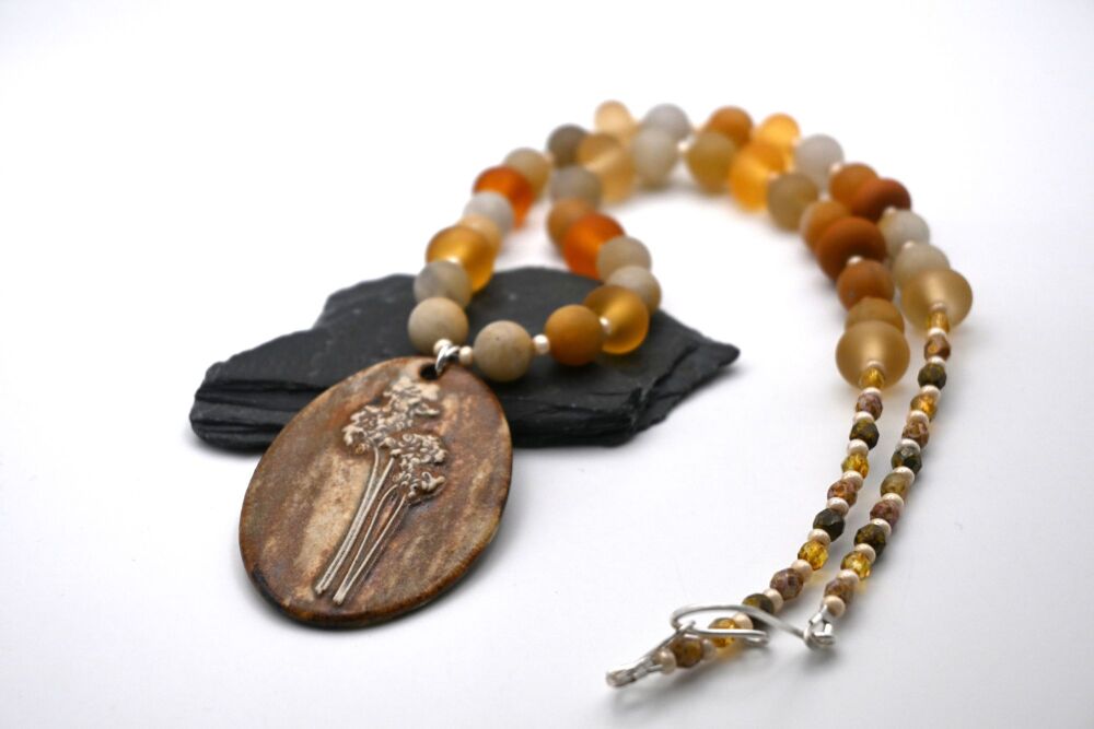 yellow jade and ceramic pendant