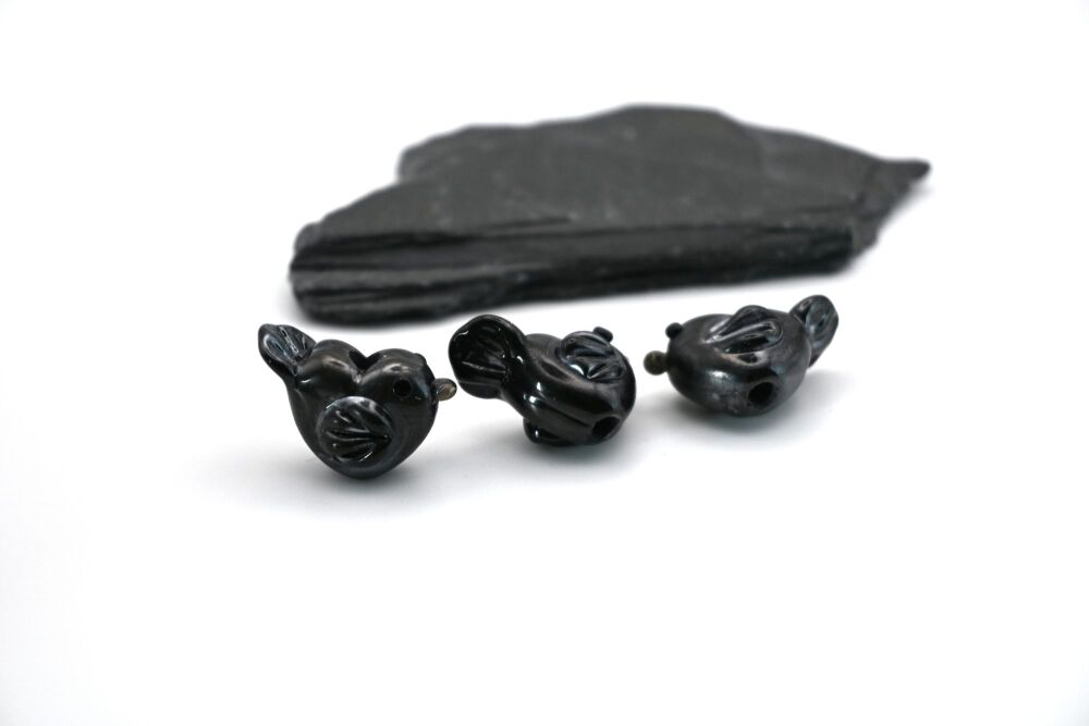 small black metallic bird