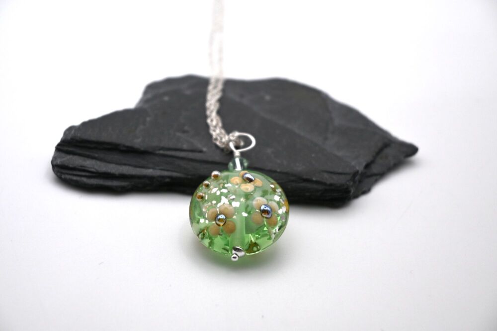 pale green and gold glitter flower pendant