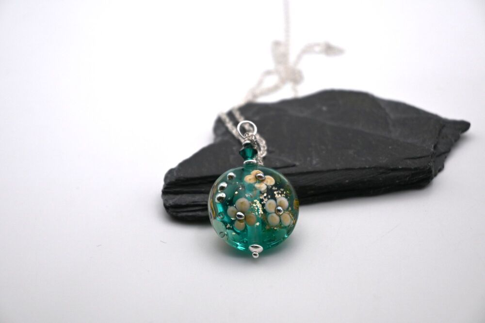 teal and gold glitter flower pendant