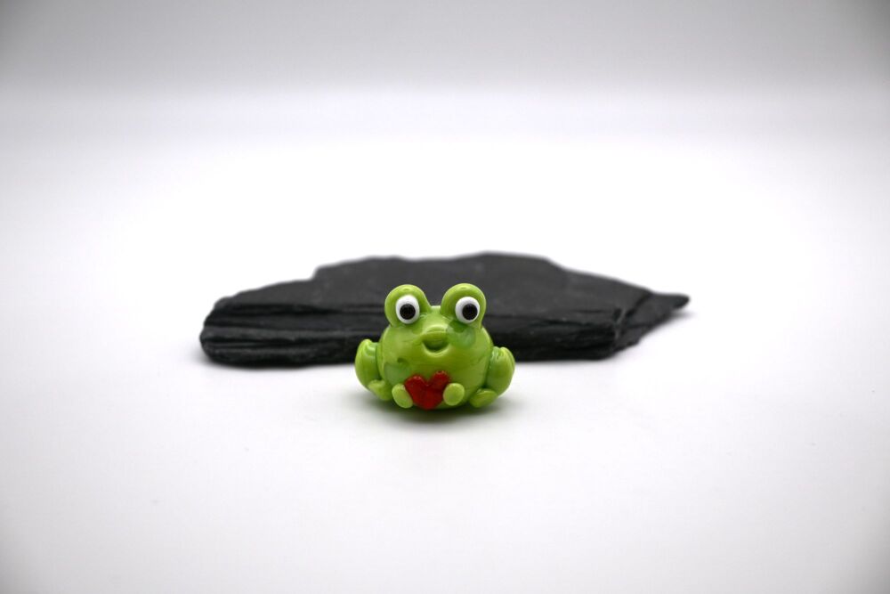 frog holding heart