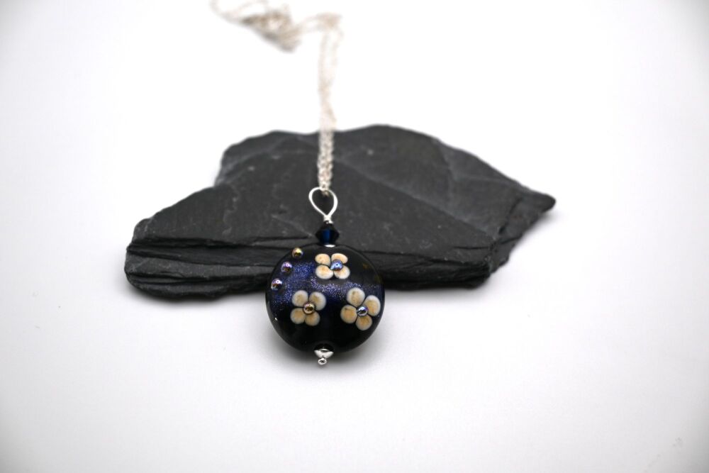 blue goldstone and flowers