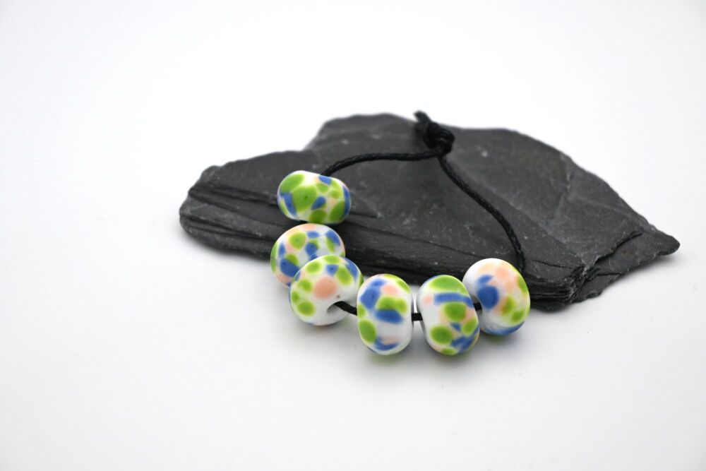 white, blue and green frit tumbled