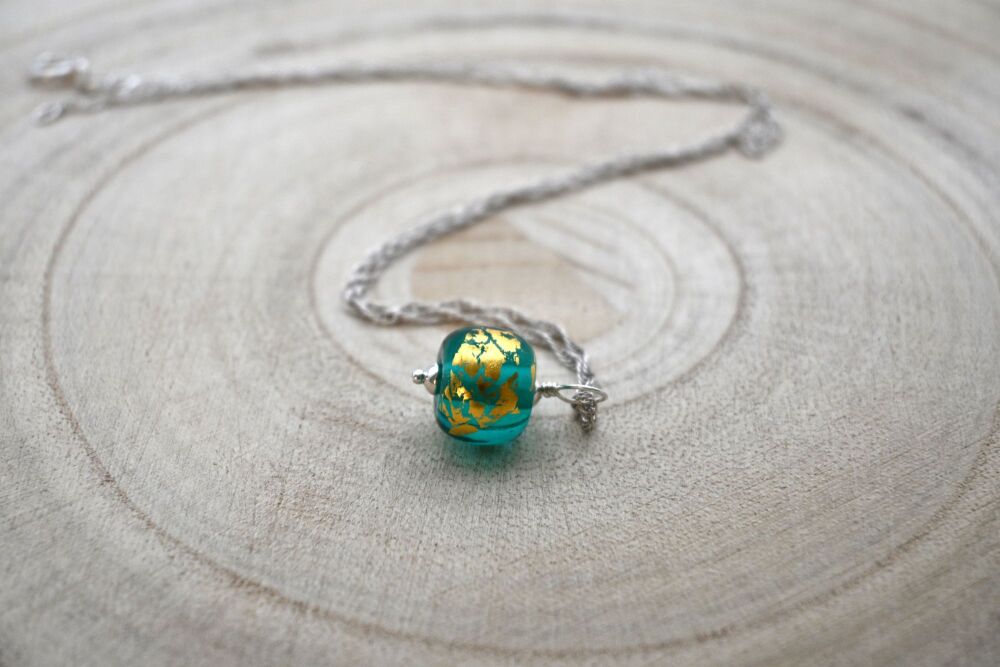 teal and gold leaf