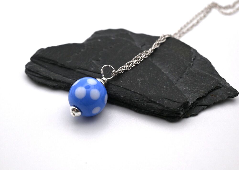 blue and white polka dot sphere