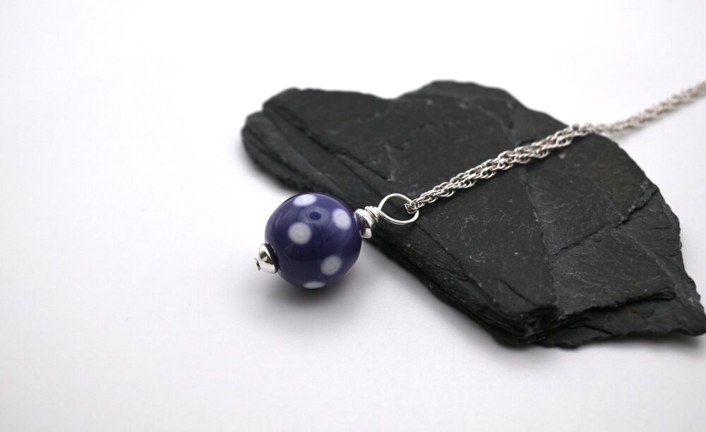 purple and white polka dot sphere