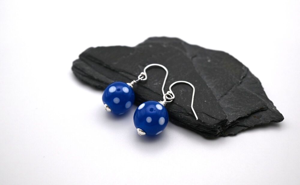 dark blue and white polka dot drops