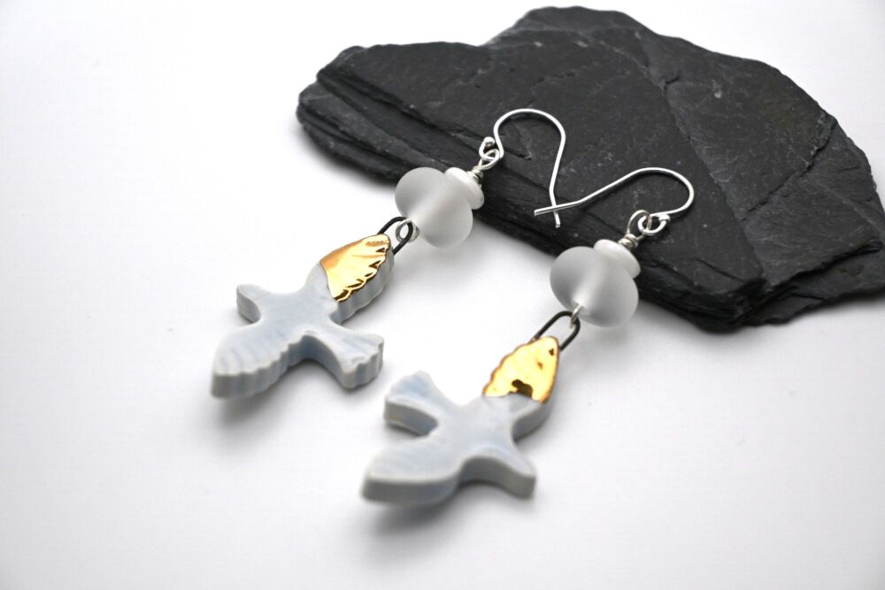 white and gold birds