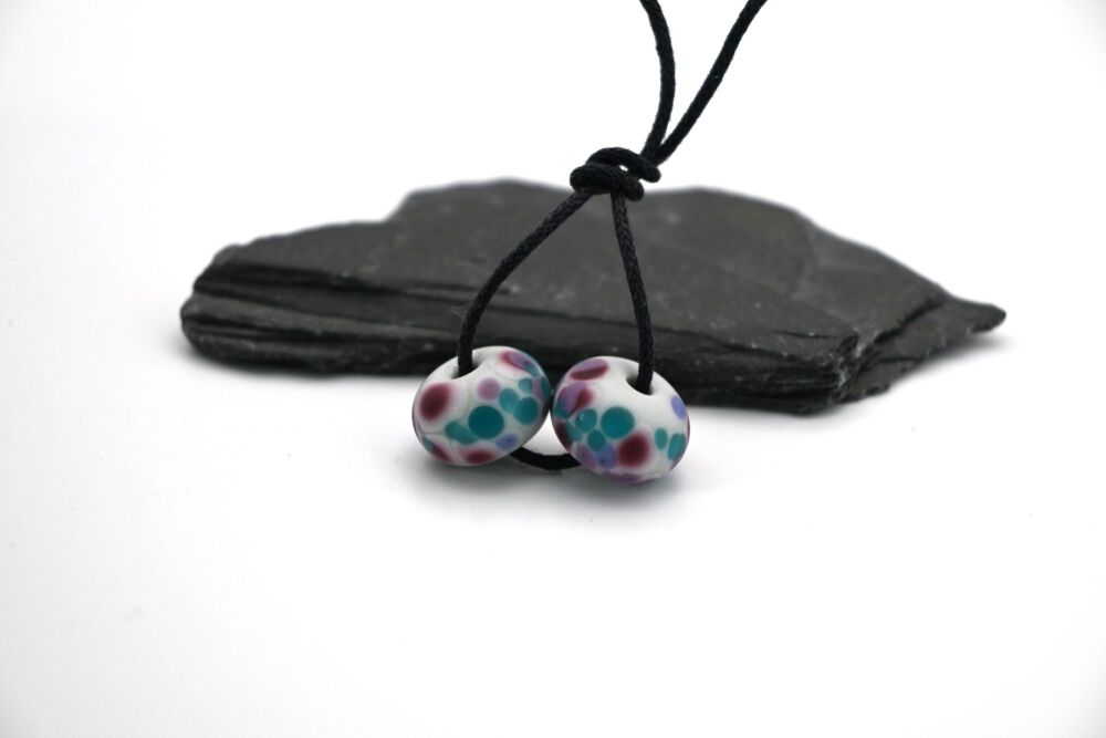 grey and purple frit tumbled