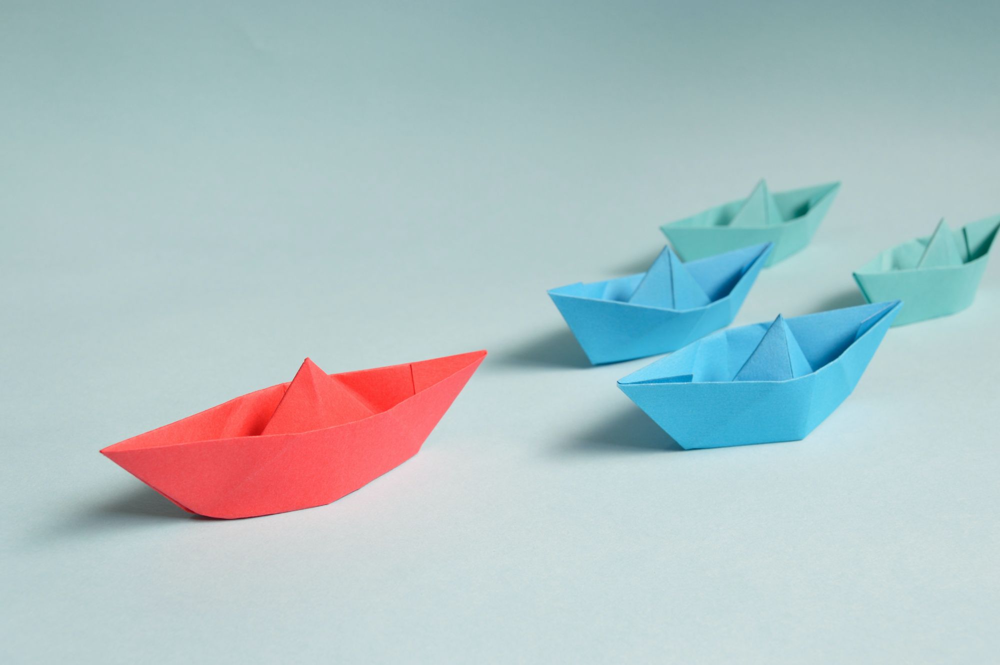 paper boats denoting leadership and teams