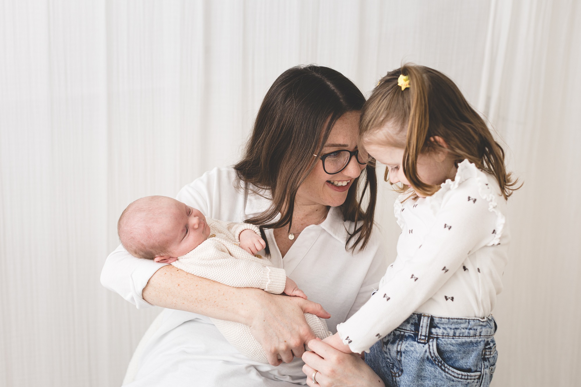 Laura holding newborn Lukas, and Klara