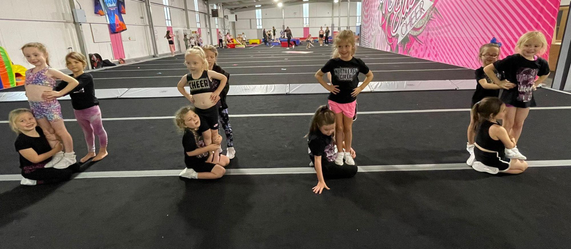 Groups of young girls practising cheer.