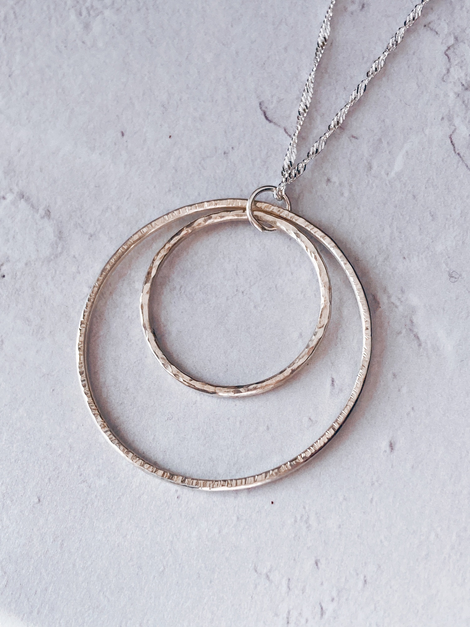 2 textured silver rings pendant