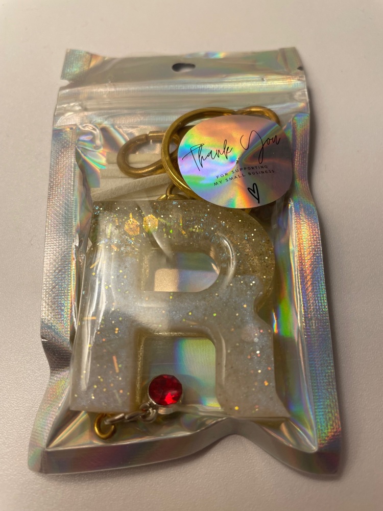 Letter ‘R’ with a Ruby charm (removable)