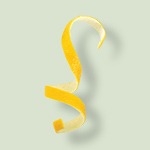 Bright yellow lemon zest curls, providing a sharp citrus zing and fresh aroma