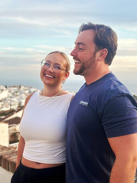 A young couple head for the Nerja bus, The scenic mountain view from the Nerja to Frigiliana bus route overlooking the coast of Spain