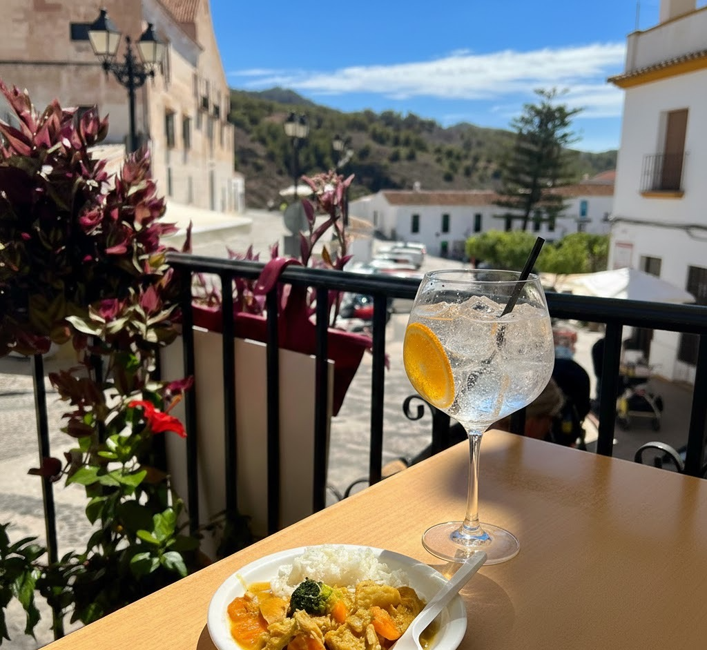 A refreshing Davison & Brogan gin and tonic sitting on a sun-drenched terrace after a mountain bike ride.