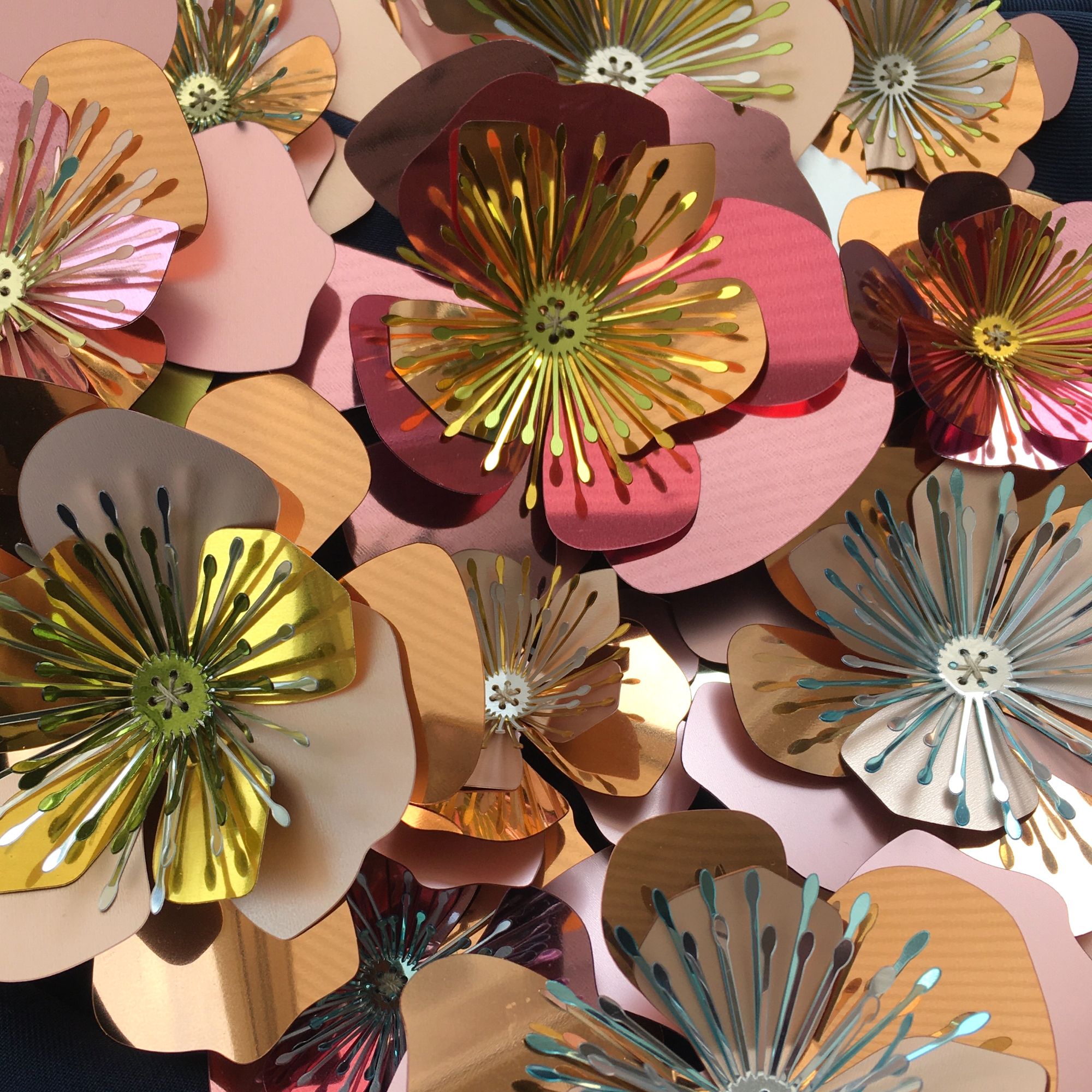 Bespoke sequin design of 3D flowers with layers of petals in pinks and golds