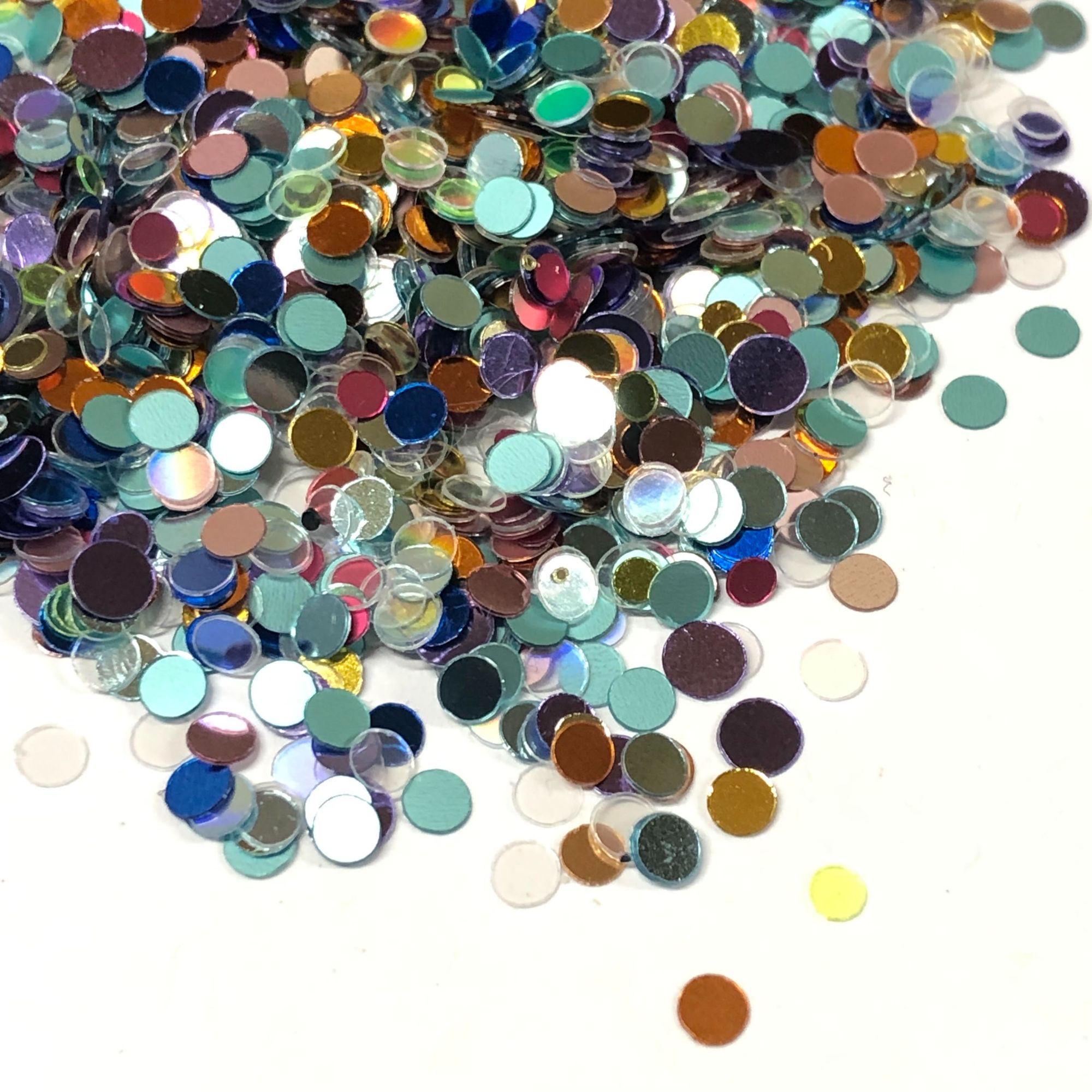 Recycled plastic circles of glitter in various bright shiny colours