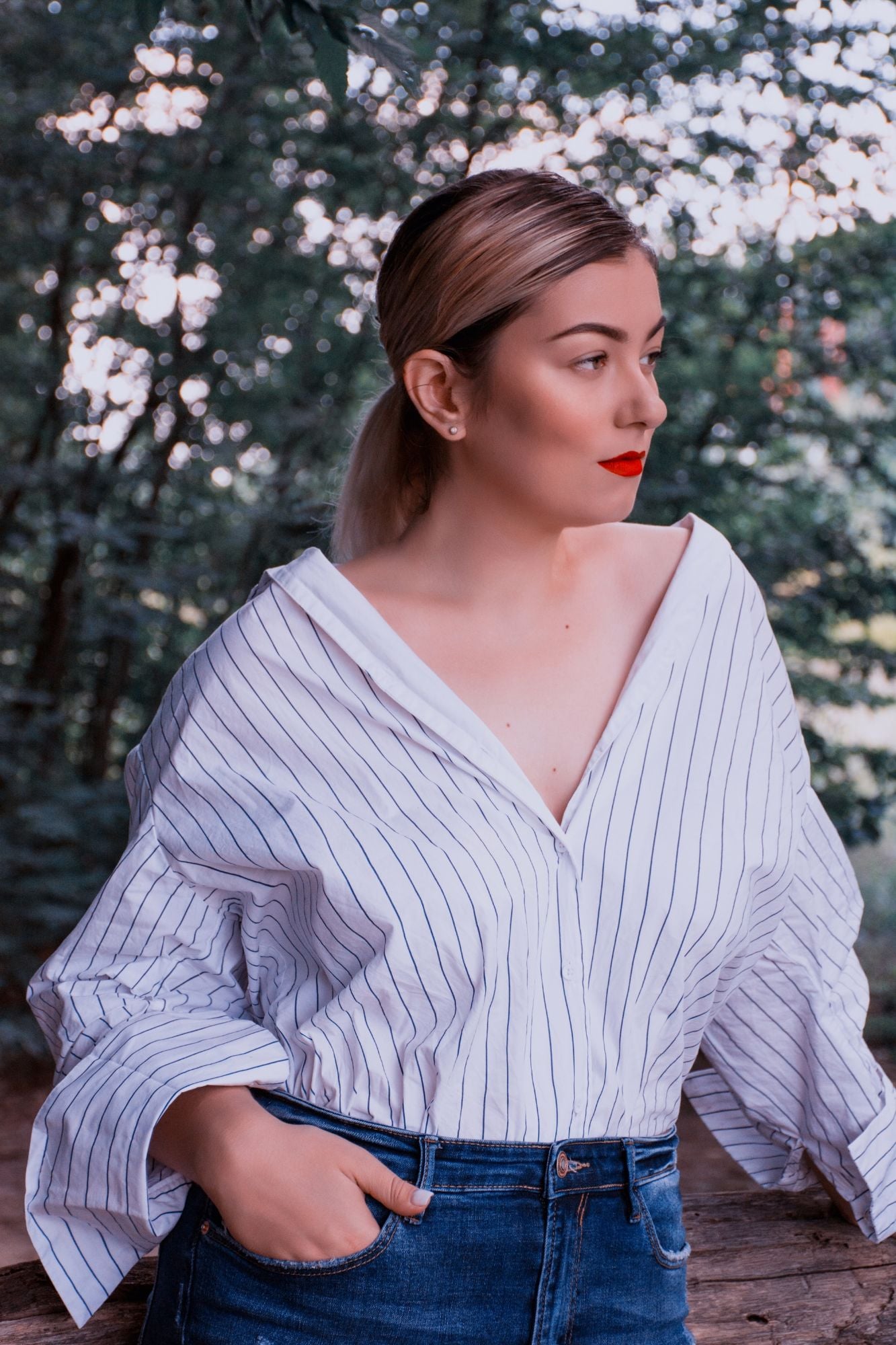 Co-ordinating animal print blouse, shoes and earrings with a magazine and flowers