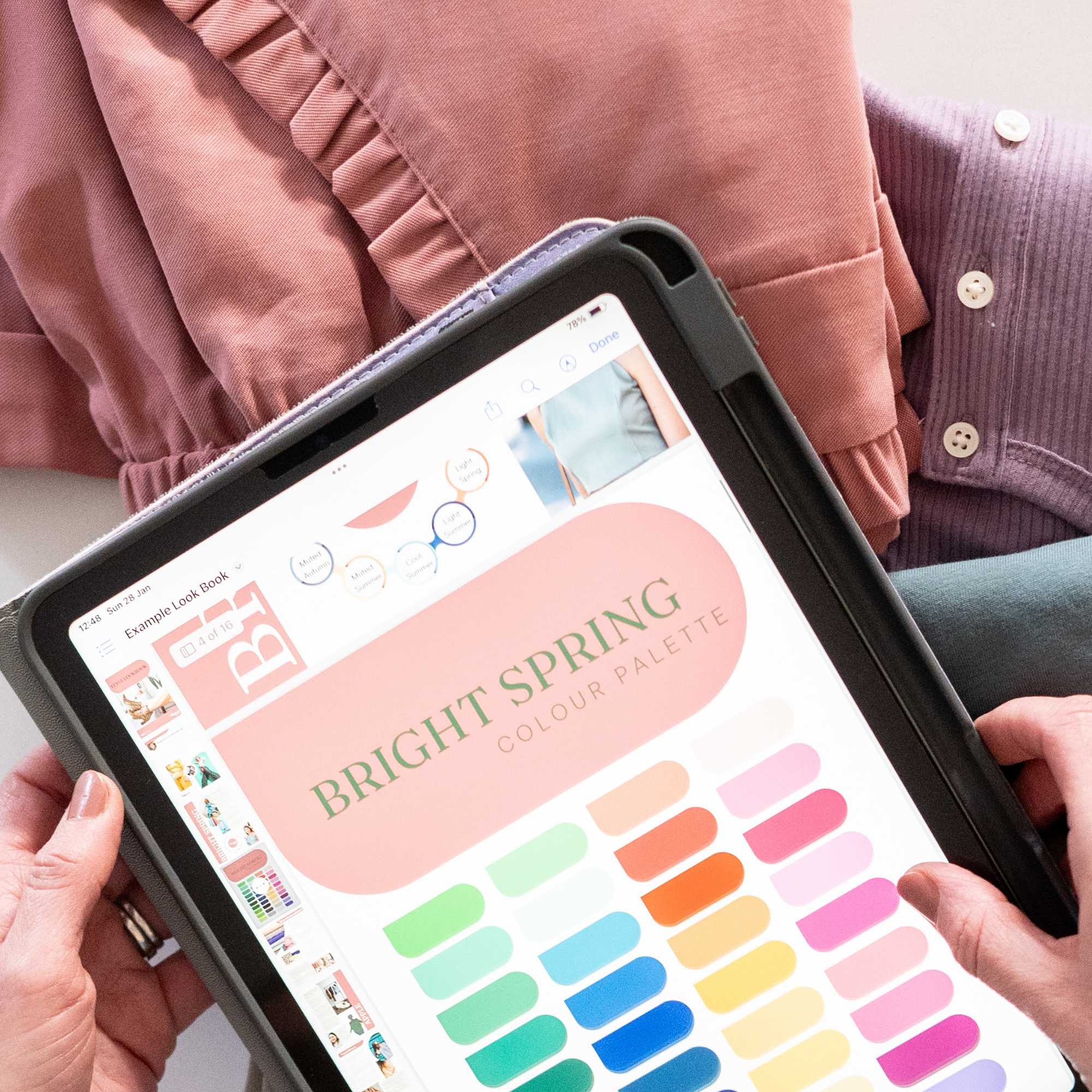 Colour analysis in Guildford with colour matching drapes in pink and peach being held up against a client's face