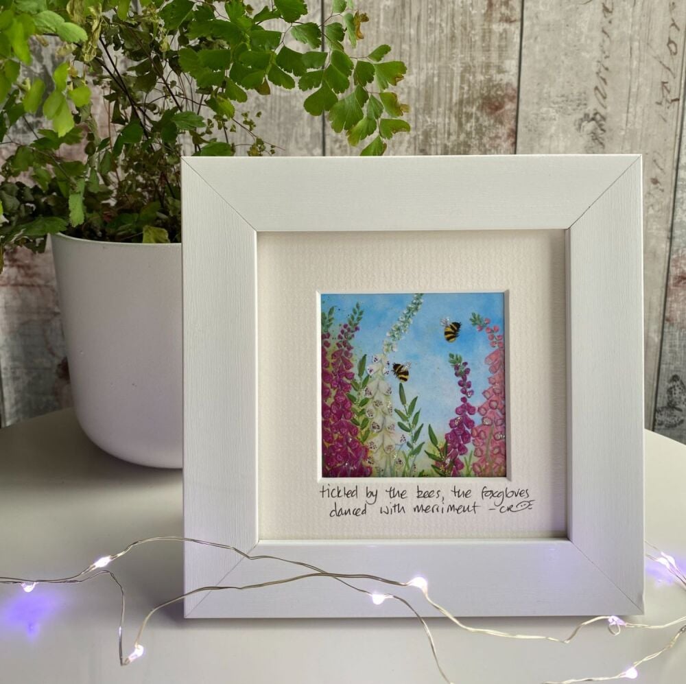 Tickled by the bees Mini Framed Print