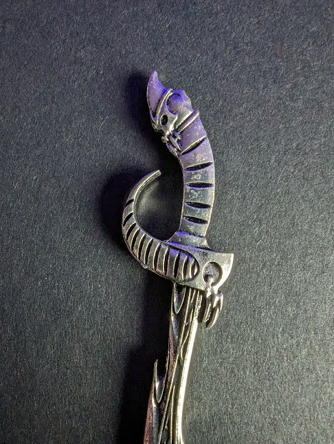 Side Skull Jagged Edge Sword