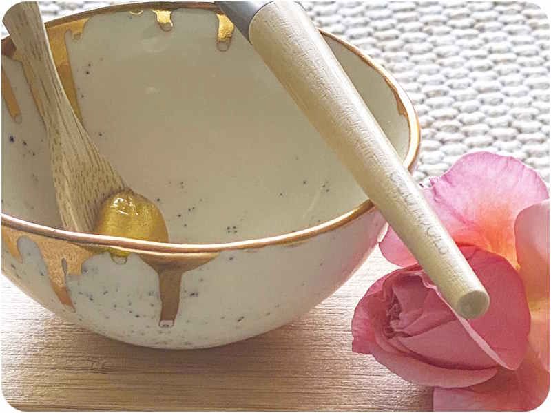 Handmade ceramic bowl with gold face mask & rose petals