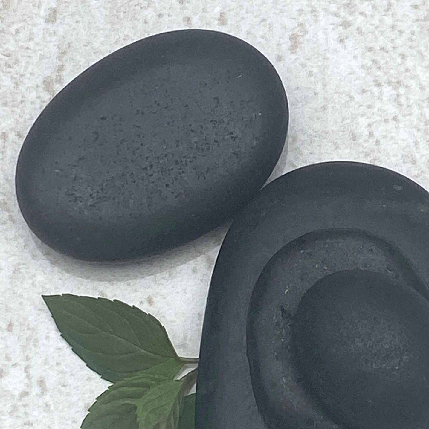 1. Warm basalt stones and mint leaves, used in relaxing hot stone facials by Lucy.