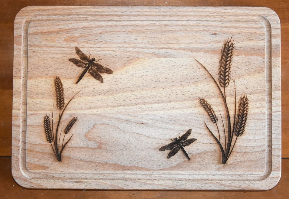 Small chopping board with dragonfly design