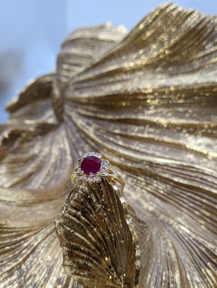 Ruby and diamond halo Ring in 18K Yellow Gold