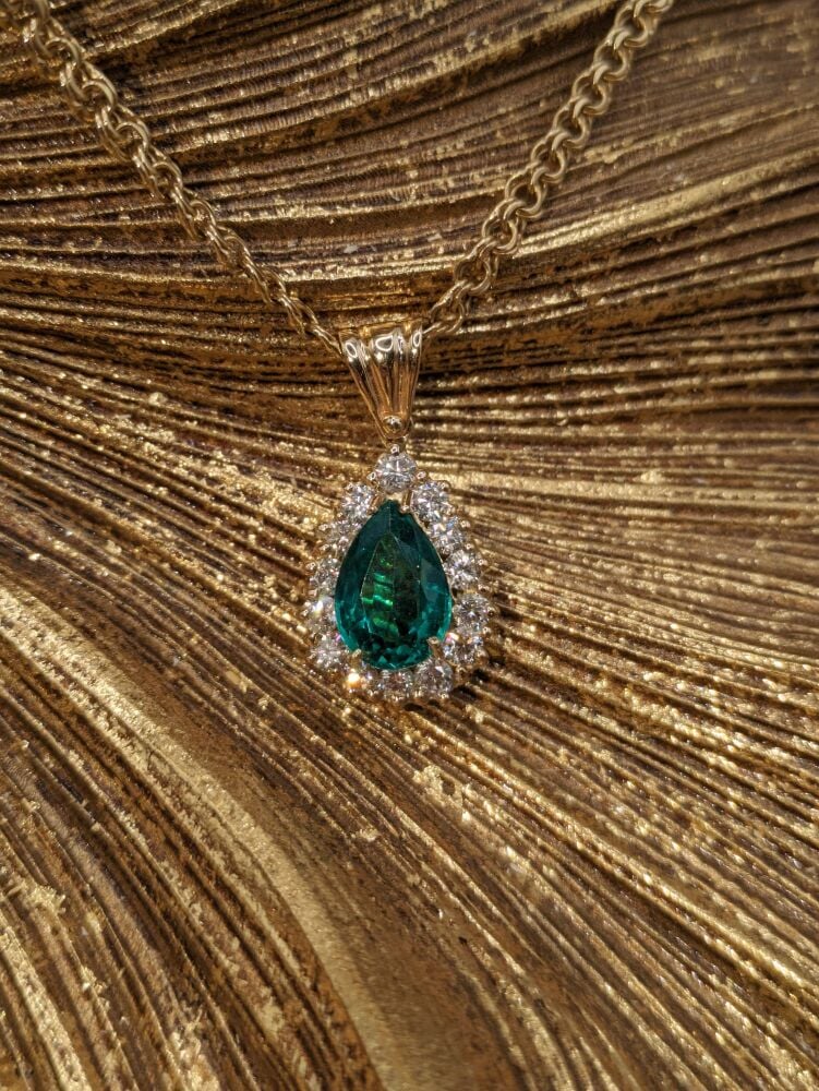 Emerald Pear cut halo pendant on chain