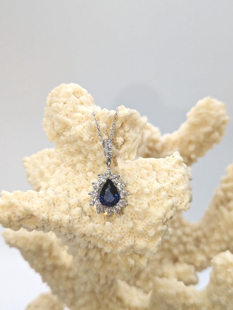 Pear cut Sapphire & diamond halo pendant