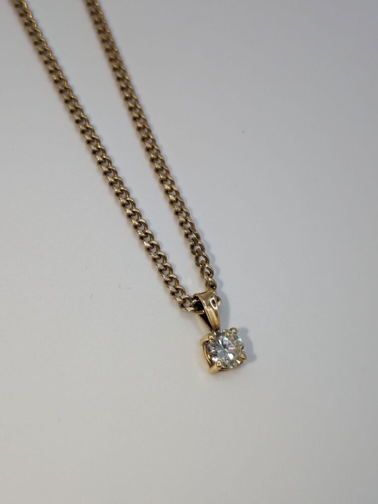 Round solitaire pendant on curb chain 0.67ct VS1/ F